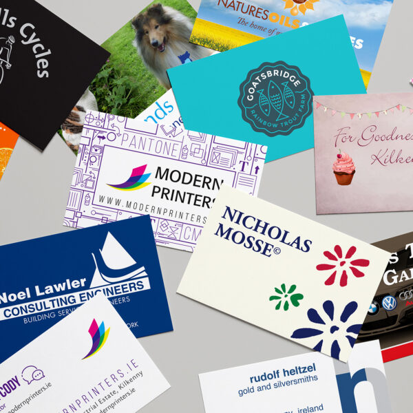Colourful business cards spread across a table.