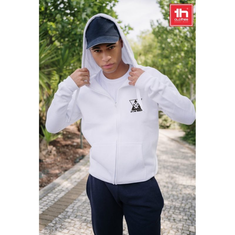 Man wearing white hoodie outdoors