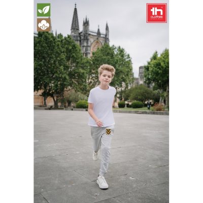 Boy in casual attire walking outdoors