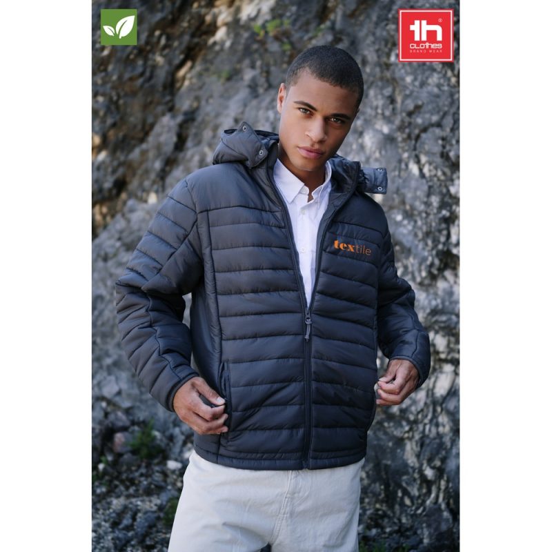 Man wearing dark puffer jacket outdoors