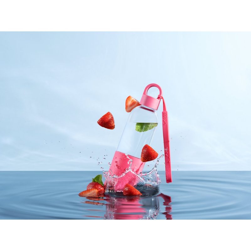 Water bottle with strawberries and mint splashing.