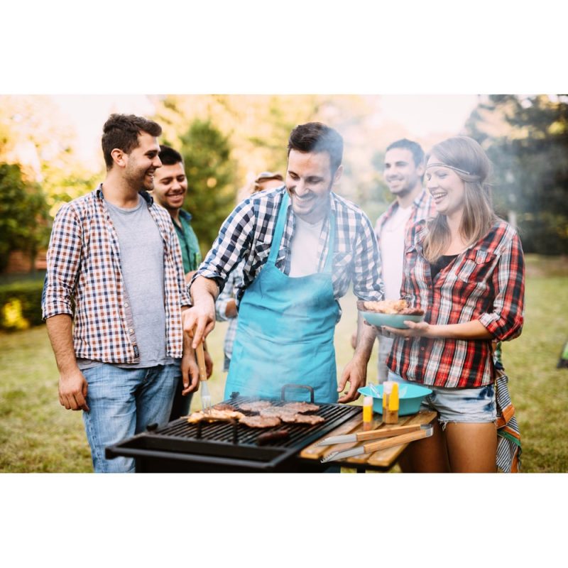 Friends enjoying a barbecue outdoors.