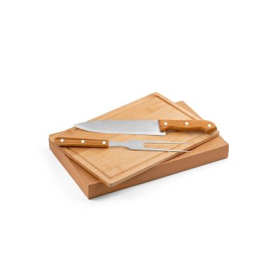 Wooden carving board with knife and fork set.