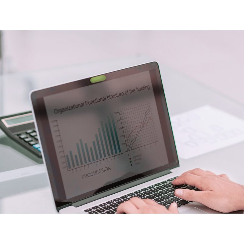 Laptop displaying organisational structure chart and graphs.