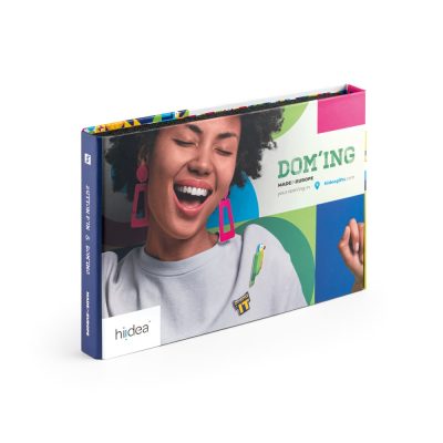 Colourful brochure with smiling woman and parrot shirt.
