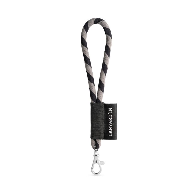 Striped lanyard with clip and black label attachment.