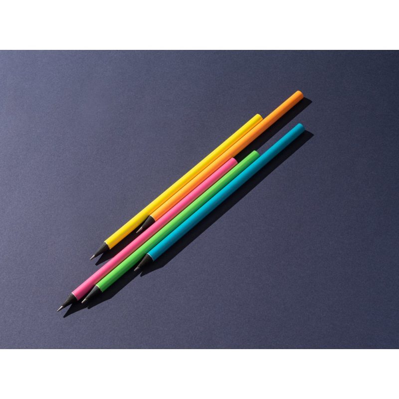 Four colourful pens on dark background