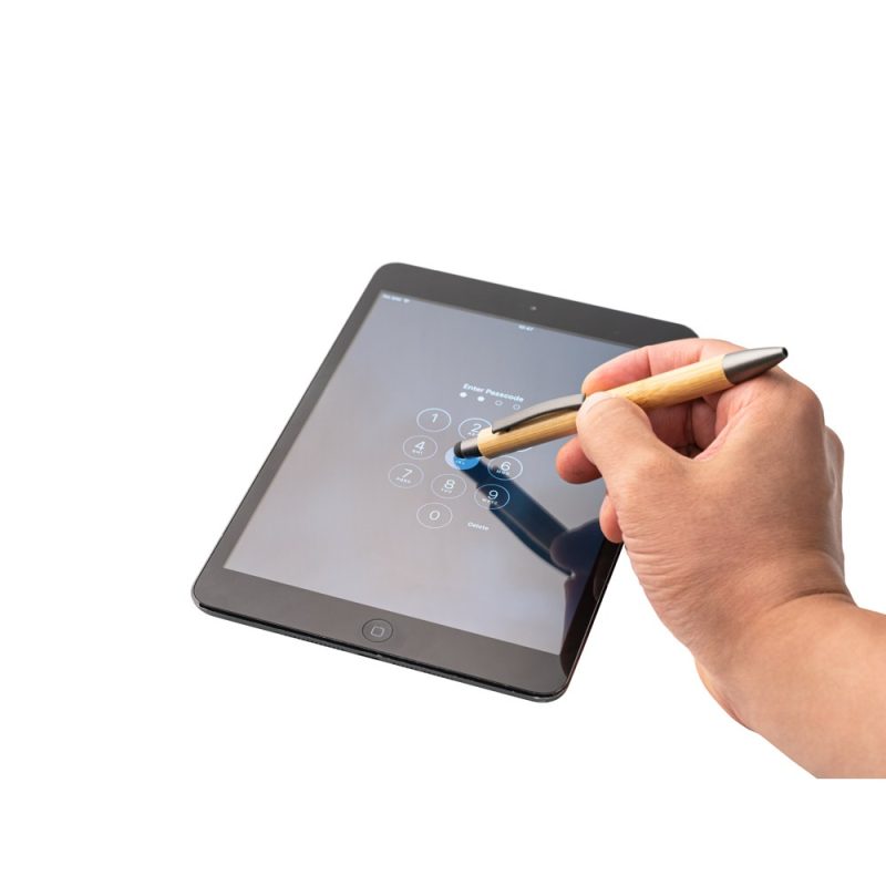 Hand using stylus on tablet screen.