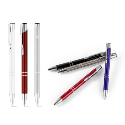 Assorted coloured pens on white background.