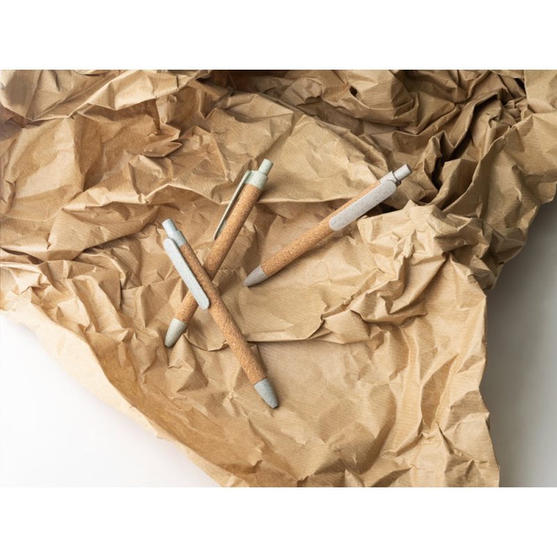 Eco-friendly pens on crumpled paper surface