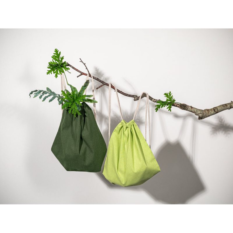 Eco-friendly drawstring bags on tree branch