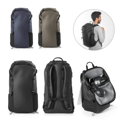 Multiple backpacks display with man wearing black one.