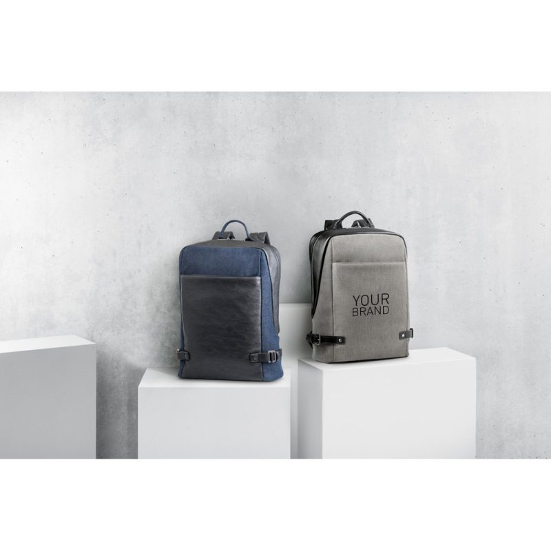 Two backpacks on display pedestals