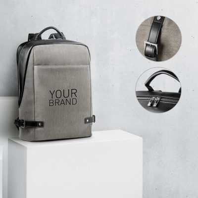 Grey backpack with brand design, close-up details.
