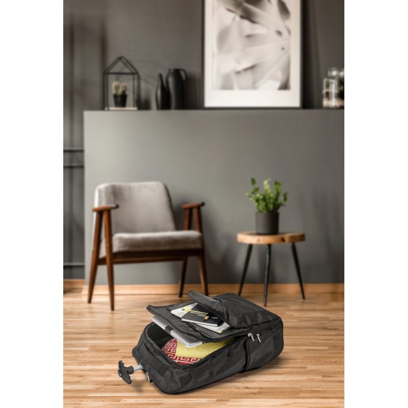 Open suitcase with documents in stylish room.