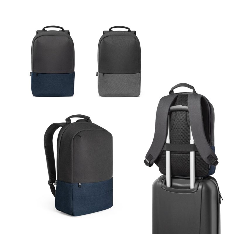 Various stylish backpacks on display next to suitcase.