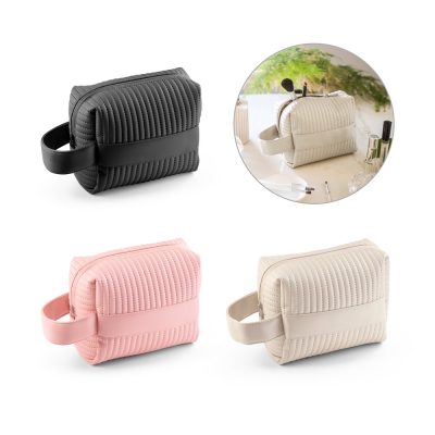 Quilted cosmetic bags in black, pink, and beige.
