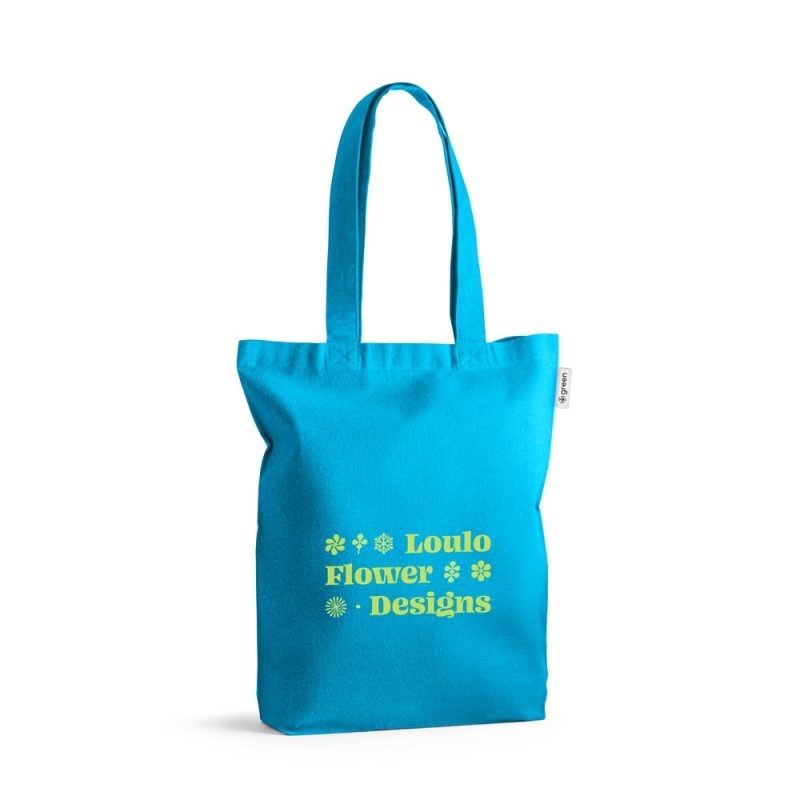 Blue tote bag with flower designs and text.