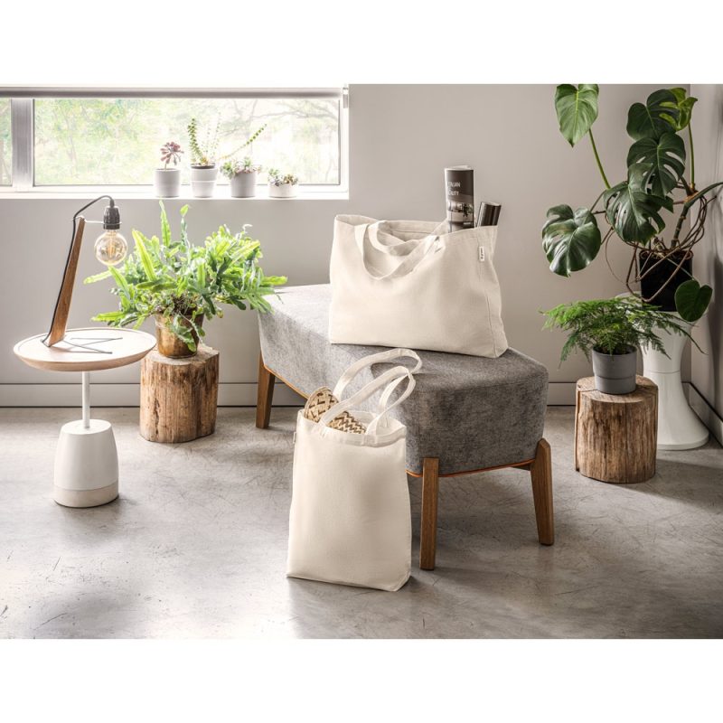 Minimalist room with plants and white tote bags