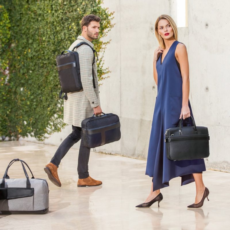 Stylish individuals with designer bags outdoors