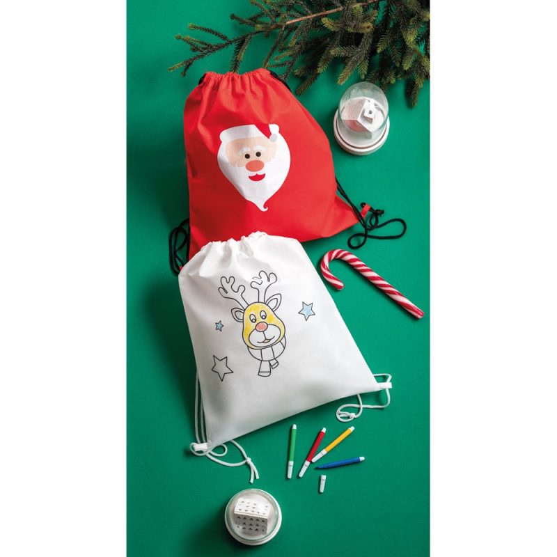 Christmas gift bags with Santa and reindeer designs.