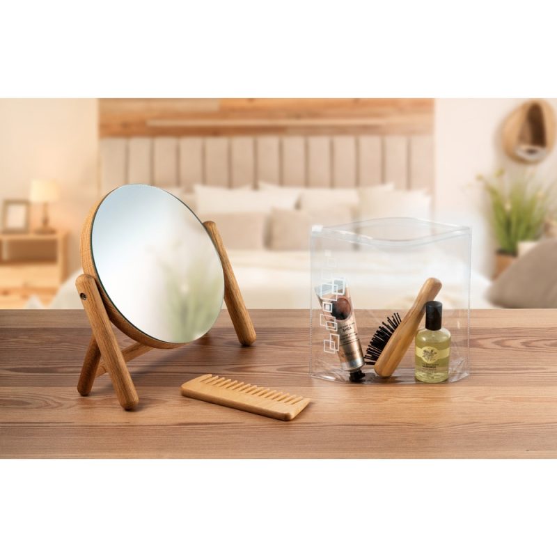 Vanity set with mirror, comb, and toiletry items.