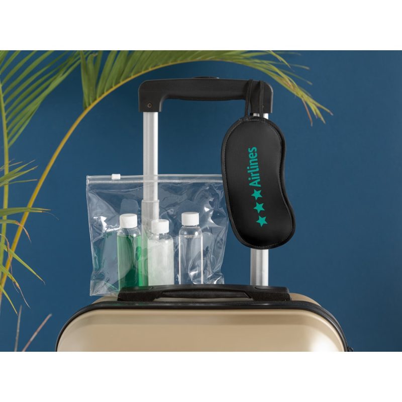 Luggage with travel amenities and sleeping mask