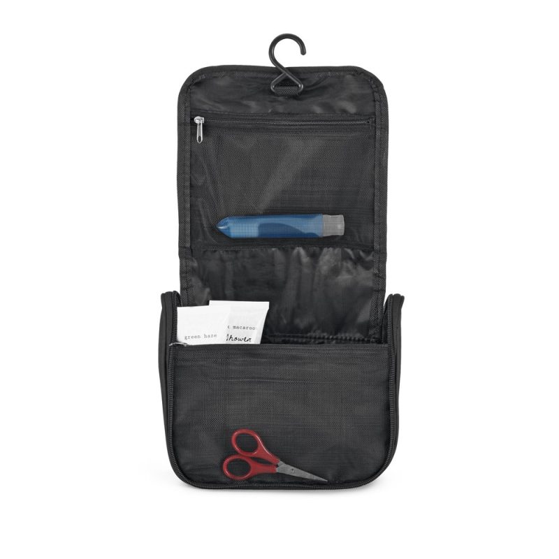 Hanging toiletry bag with scissors, pockets open