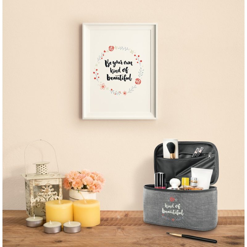 Cosmetic bag, framed quote, candles on table.