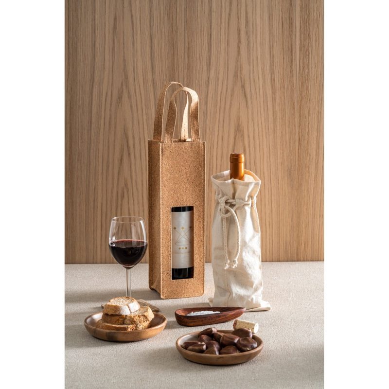 Wine, cork bags, snacks on wooden table.