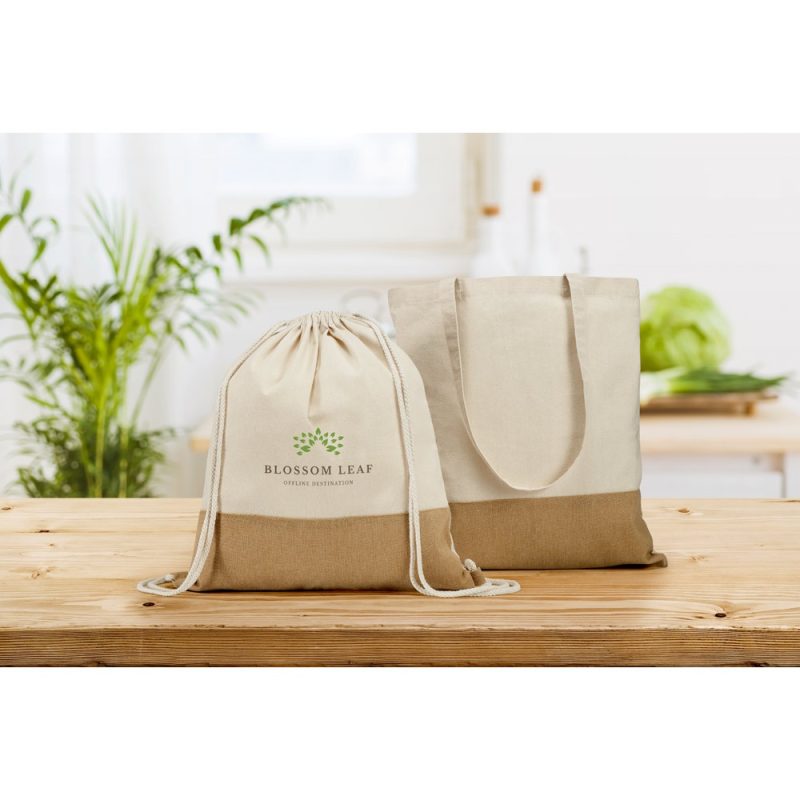 Eco-friendly canvas bags on wooden table