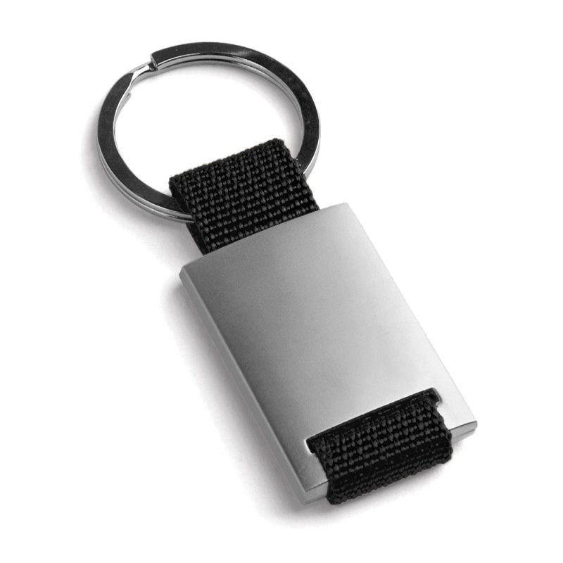 Metal and fabric keyring on white background.