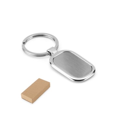 Silver keyring with rectangular tag and gift box.