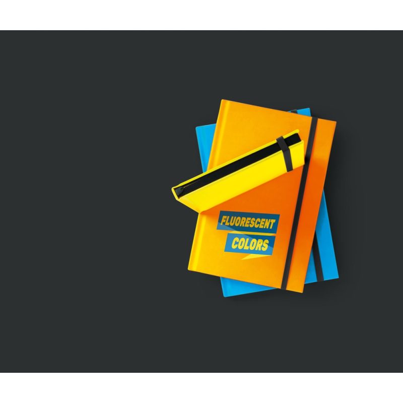 Yellow notebook and highlighter on dark background.