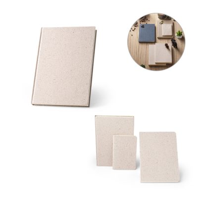 Assorted beige notebooks on wooden surface