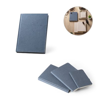 Blue notebooks in various sizes on wooden table.