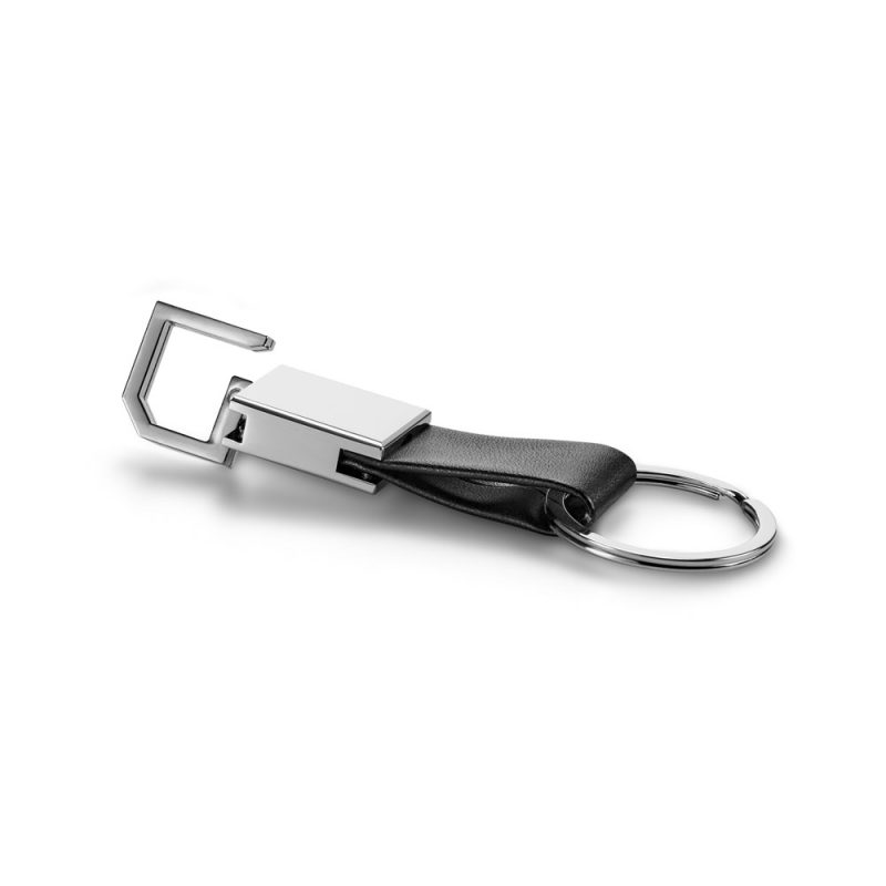 Metal and leather keyring on white background.