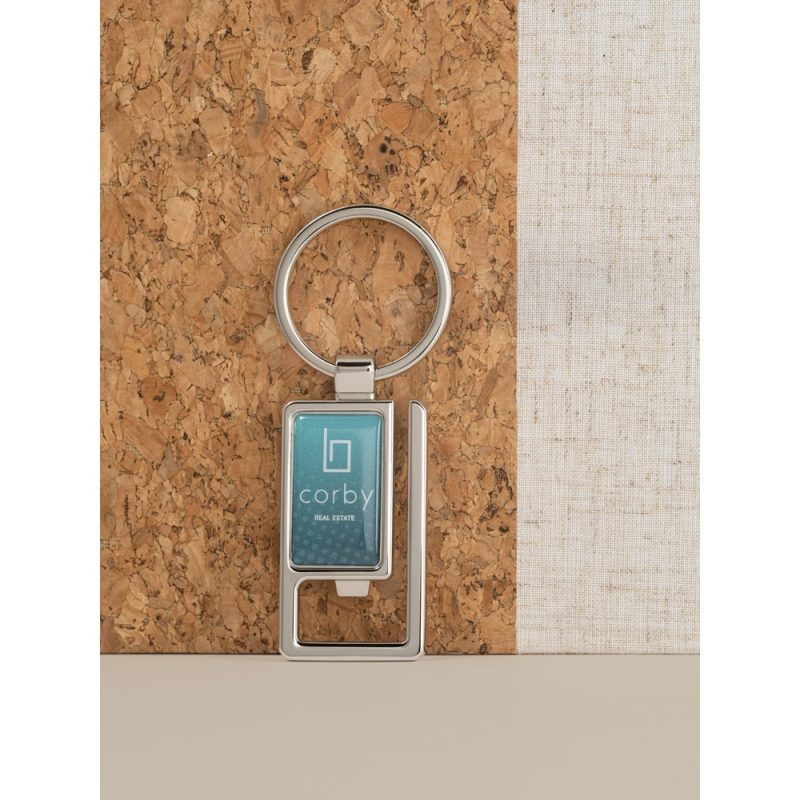 Silver keyring with Corby Real Estate logo.