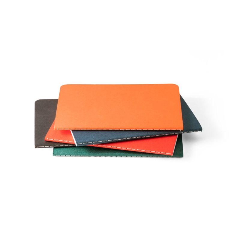 Stack of colourful notebooks on white background.