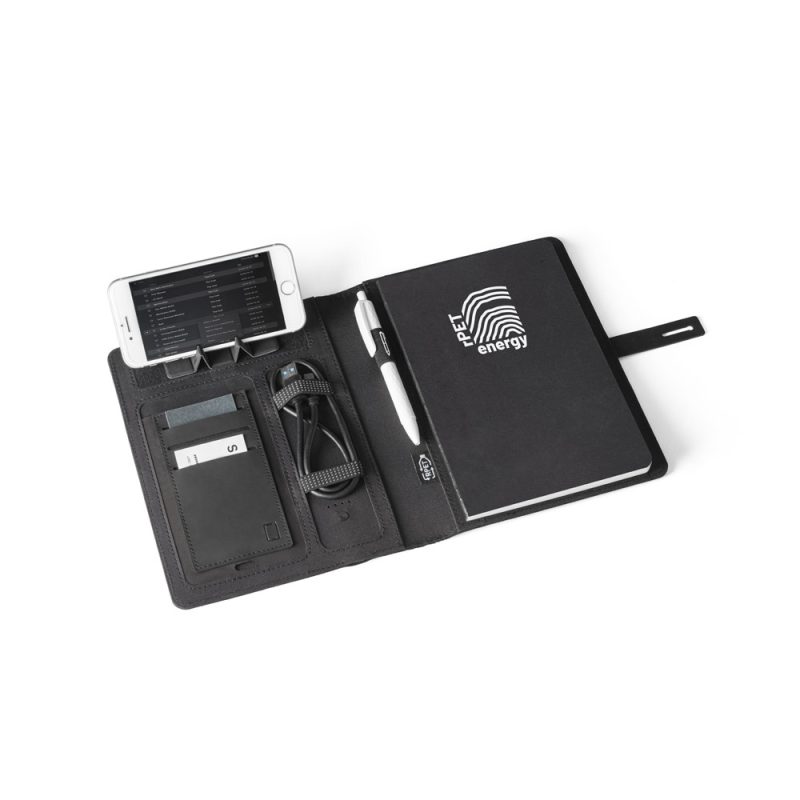 Black folio open with phone, notebook, and pen.