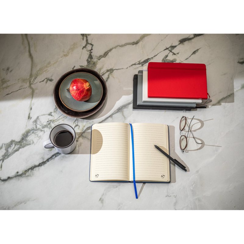Notebook, pen, glasses, apple, coffee on marble table.