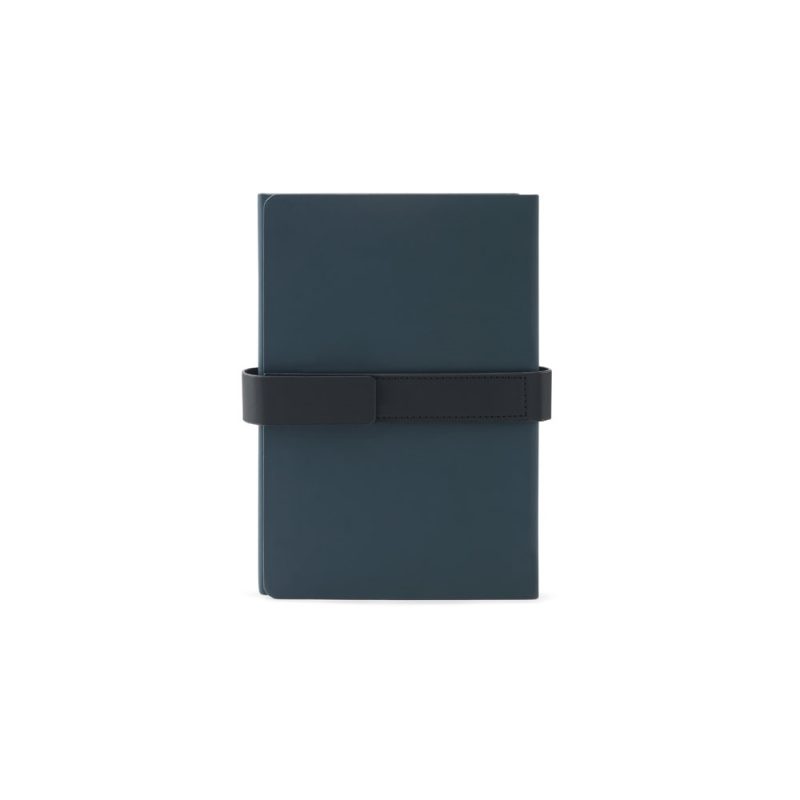 Dark journal with black strap closure.