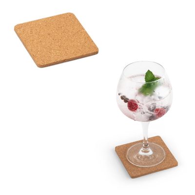 Glass of cocktail on cork coasters