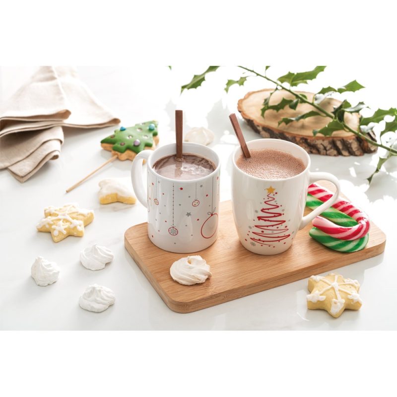 Festive hot chocolate with cookies and candy canes.