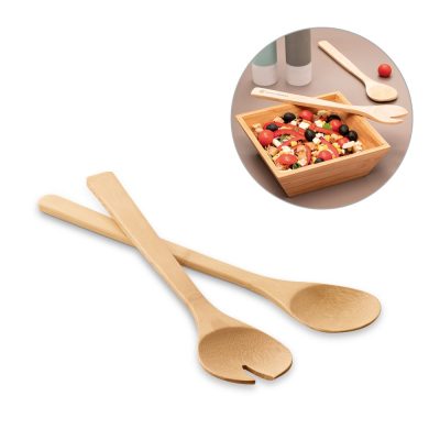 Bamboo salad servers with a wooden salad bowl.