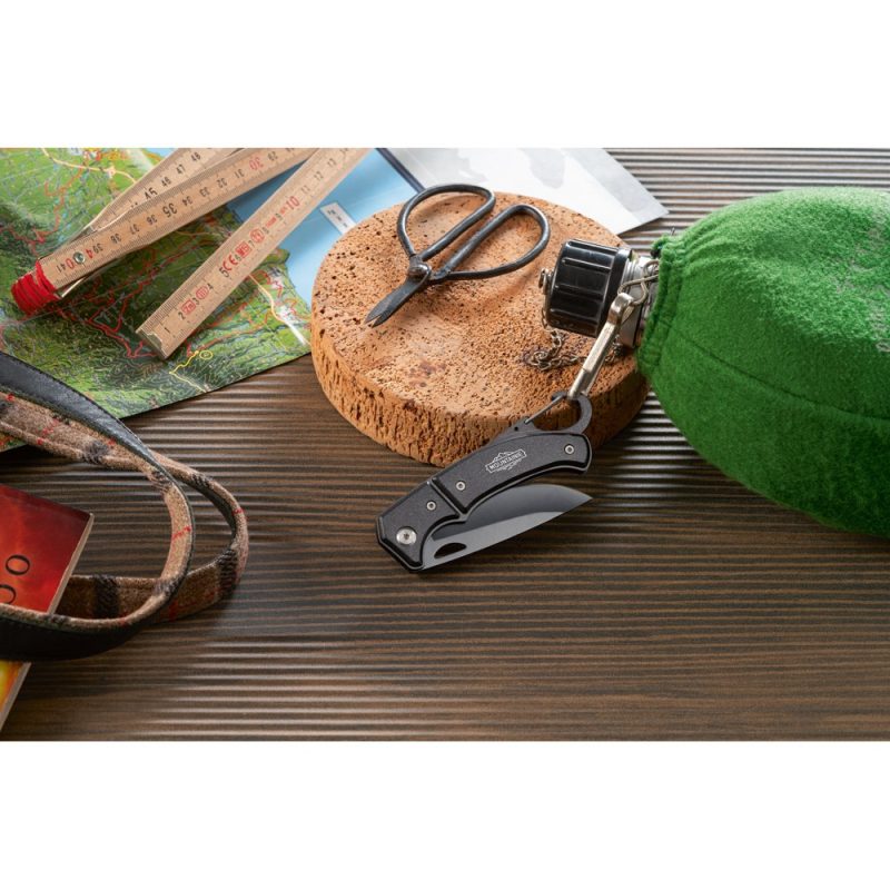 Camping tools on wooden surface