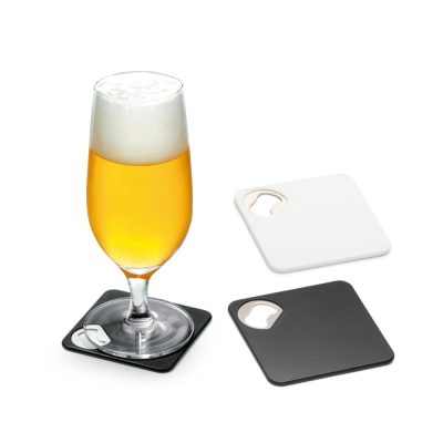 Glass of beer on coasters with bottle openers.