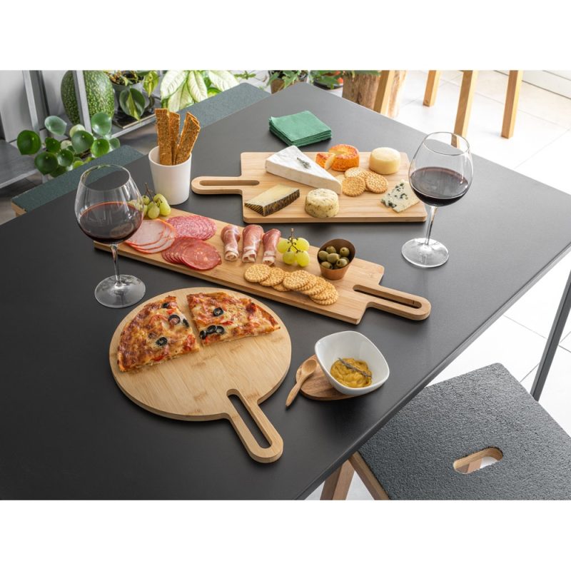 Cheese, charcuterie, pizza, and wine on wooden boards.