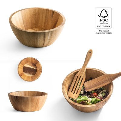 Wooden bowls and utensils with salad.