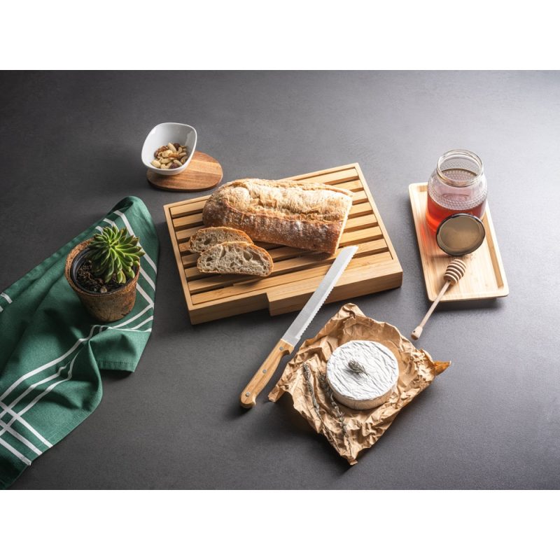 Rustic bread, cheese, honey on wooden board